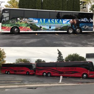 2 red motorcoaches and one with alaska on it