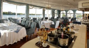 A bright, waterfront dining room for weddings at Riveredge Resort