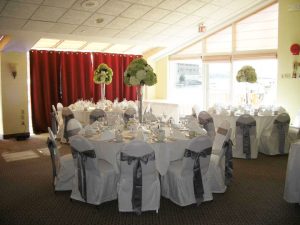 white and silver linens for wedding reception set up