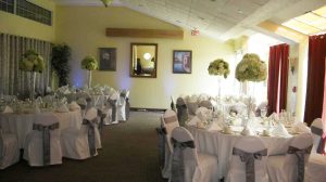 white and silver linen set up reception rooms